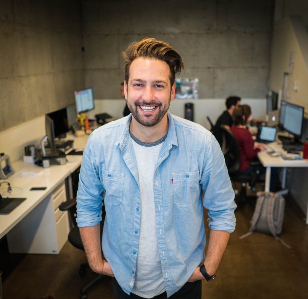 Bearded man standing in office